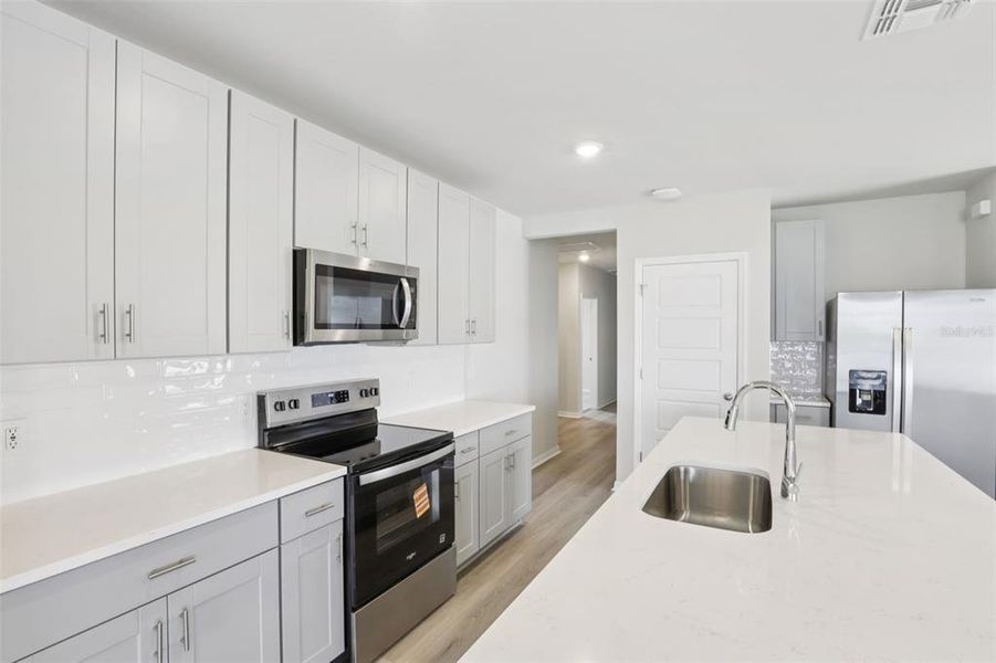 Furnished interior view inside a new home in Crescent Lakes - Premier Series, Punta Gorda (Image 8).