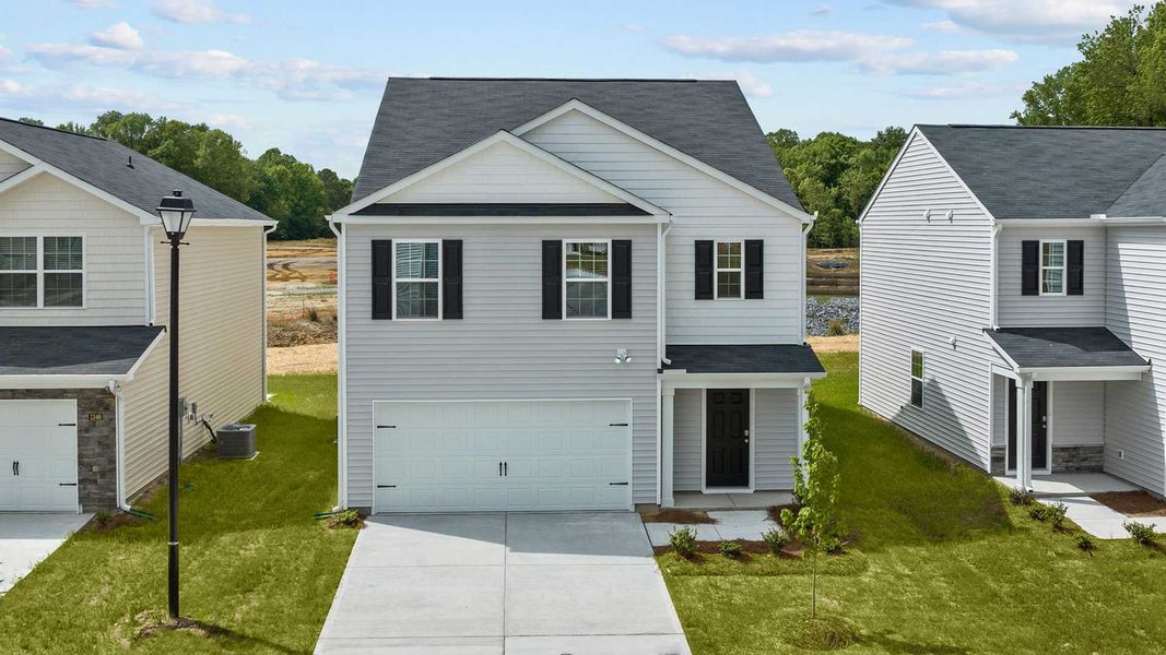 Front exterior of a new home in Carter Ridge, Greenville, NC, highlighting curb appeal (Image 16).