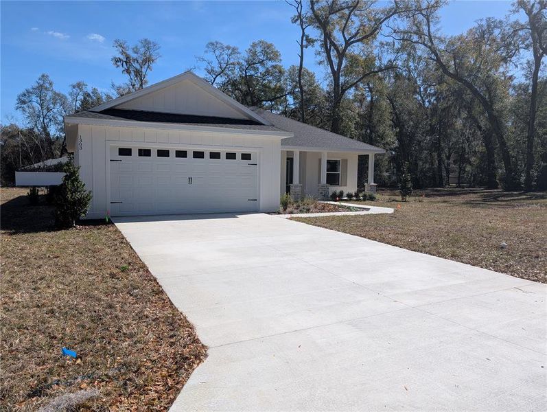 Front exterior of a new home in , Ocala, FL, highlighting curb appeal (Image 22).