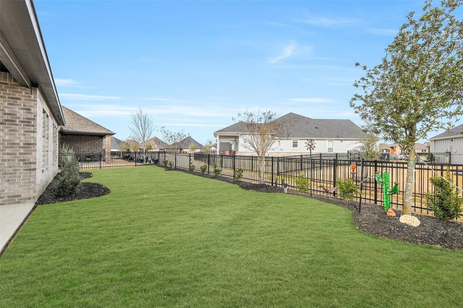 Exterior details and patio area of a home in Chambers Creek, Willis (Image 24).
