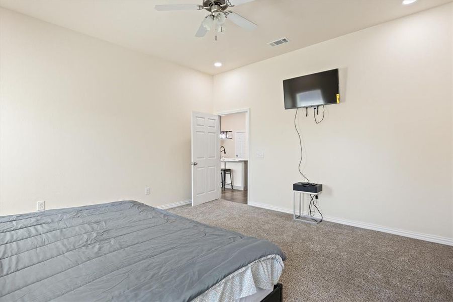 Bedroom featuring carpet and ceiling fan