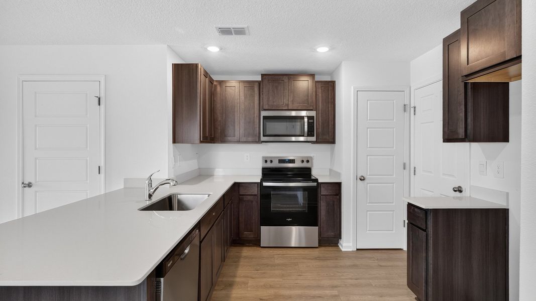 Representative furnished interior of a home built from the Weston by D.R. Horton in Bridle Creek Townhomes, Jacksonville (Image 5).