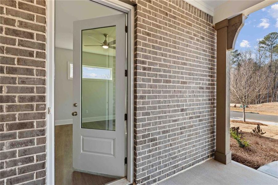 Exterior details and patio area of a home in Ashbury Commons, Powder Springs (Image 3).