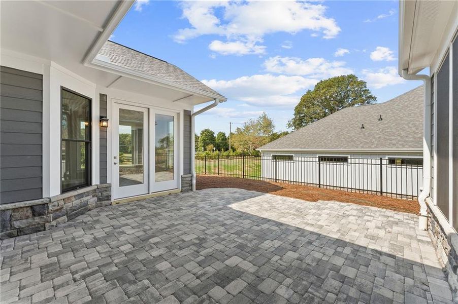 Exterior details and patio area of a home in The Courtyards at Post Road, Cumming (Image 16).