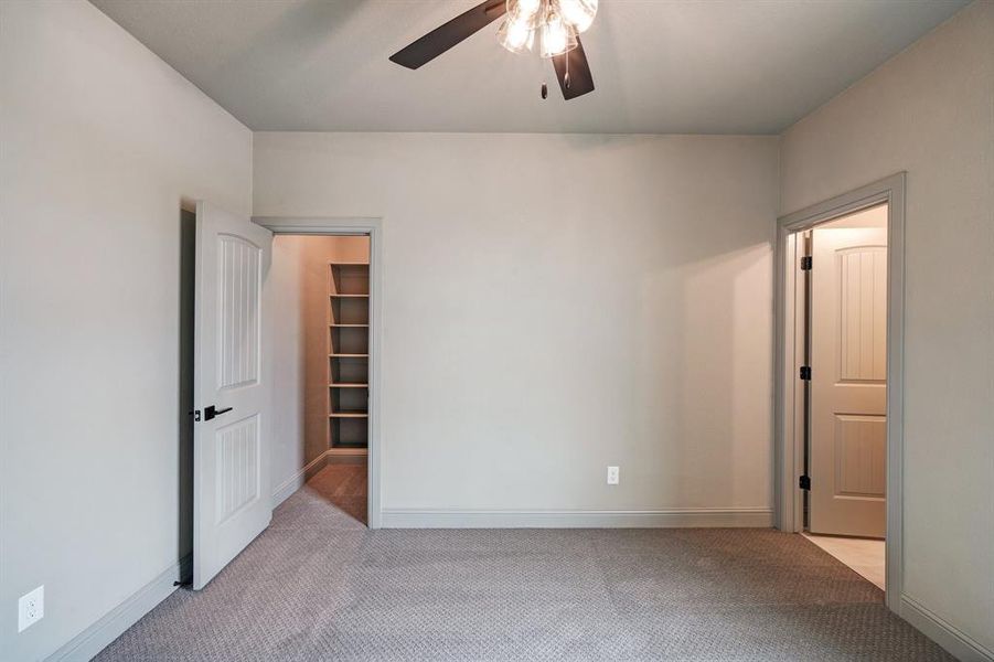 Secondary room featuring ensuite bathroom to the right.