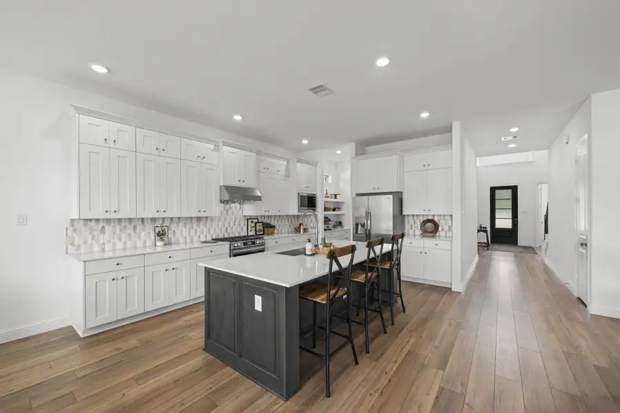 Furnished interior view inside a new home in The Highlands: Pinnacle Collection, Porter Heights (Image 4).