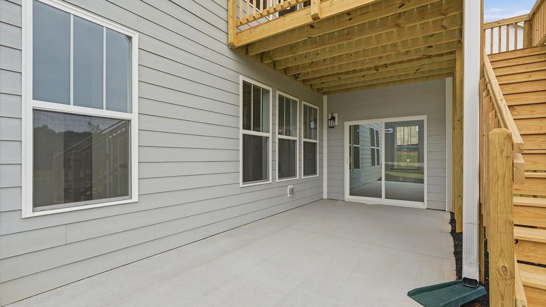 Established charm meets functional outdoor living with a spacious rear covered porch located in Woodruff, SC