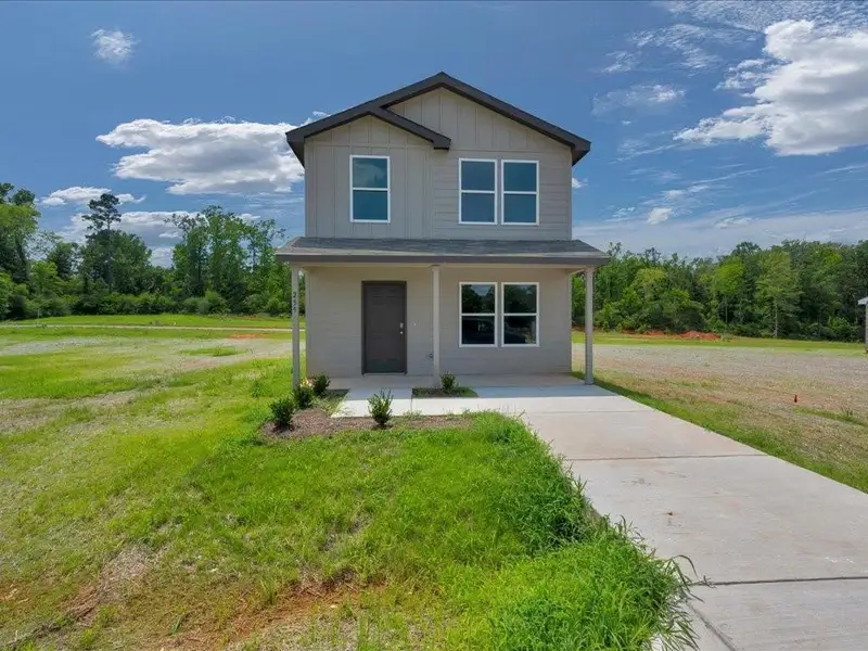 Front exterior of a new home in Redland Estates, Lufkin, TX, highlighting curb appeal (Image 1). Front exterior of a new home in Redland Estates, Lufkin, TX, highlighting curb appeal (Image 1).