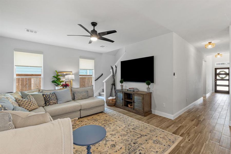 Just off the great room, stairs lead to the versatile upstairs flex room, providing flexible space for a fourth bedroom, office, or media room. This peaceful retreat offers privacy and convenience, perfectly separated from the main living areas below.