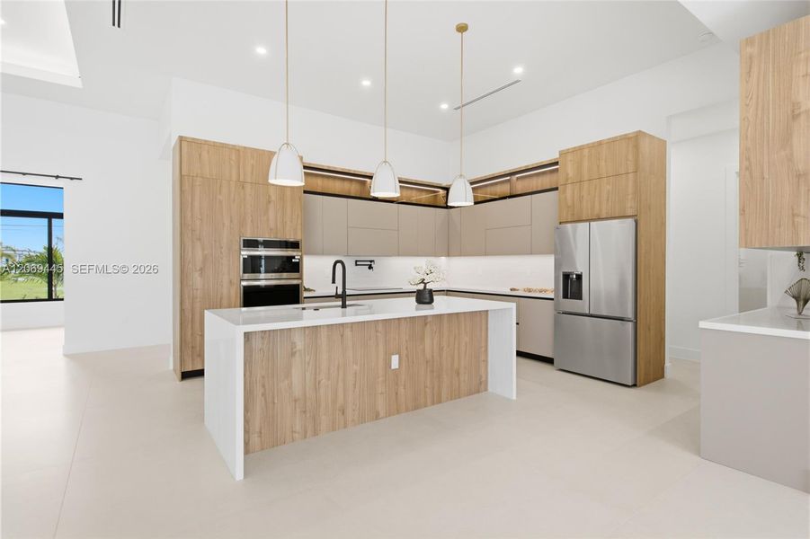 Under-cabinet LED lighting, pot filler, built-in wall oven & microwave, induction cooktop, hidden range hood, integrated cabinetry, designer pendant lighting, spacious pantry & premium stainless appliances Under-cabinet LED lighting, pot filler, built-in wall oven & microwave, induction cooktop, hidden range hood, integrated cabinetry, designer pendant lighting, spacious pantry & premium stainless appliances