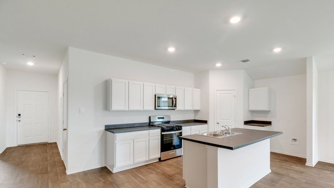 Representative furnished interior of a home built from the The Gaven by D.R. Horton in Wayside, Uhland (Image 4).