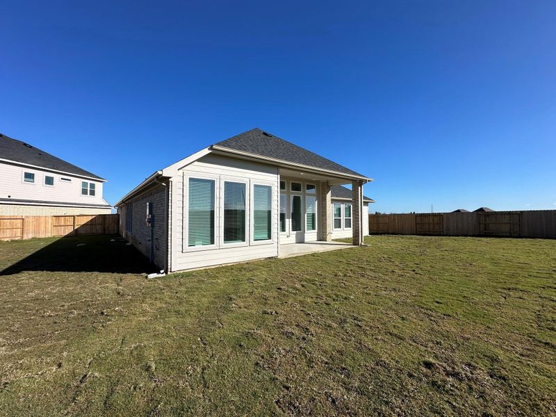 Exterior details and patio area of a home in Rates starting as low as, Iowa Colony (Image 3).