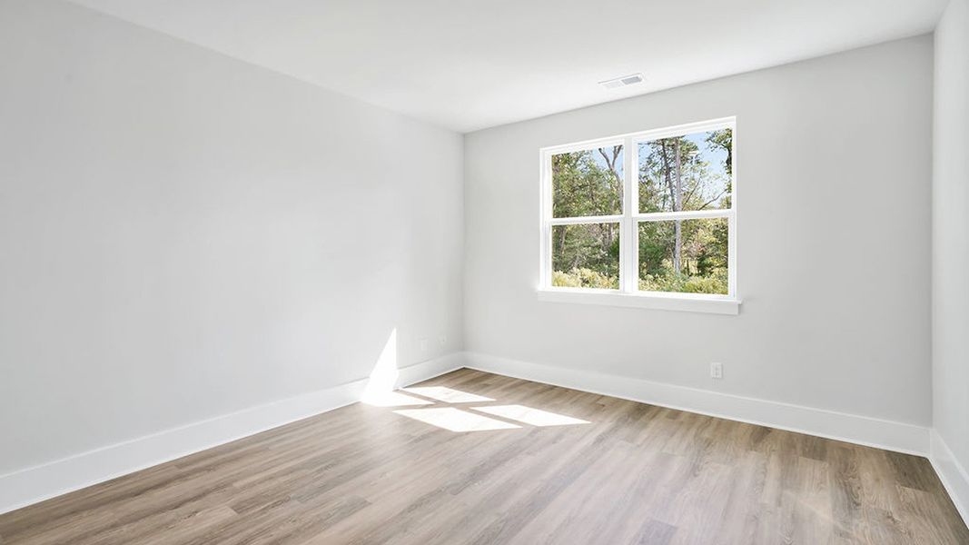 Representative unfurnished interior of a home built from the BRADFORD by D.R. Horton in Indigo Preserve, Leland (Image 25).
