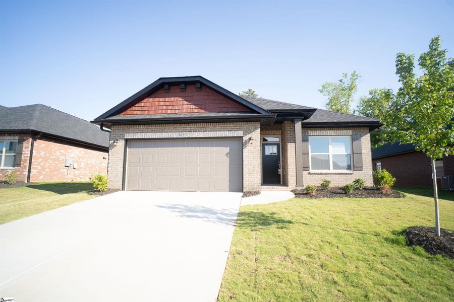 Front exterior of a home in the Heritage Crossing community, located in Simpsonville, SC (Image 1).