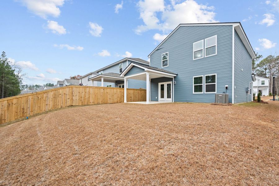 Exterior details and patio area of a home in Grand Arbor, Blythewood (Image 3).