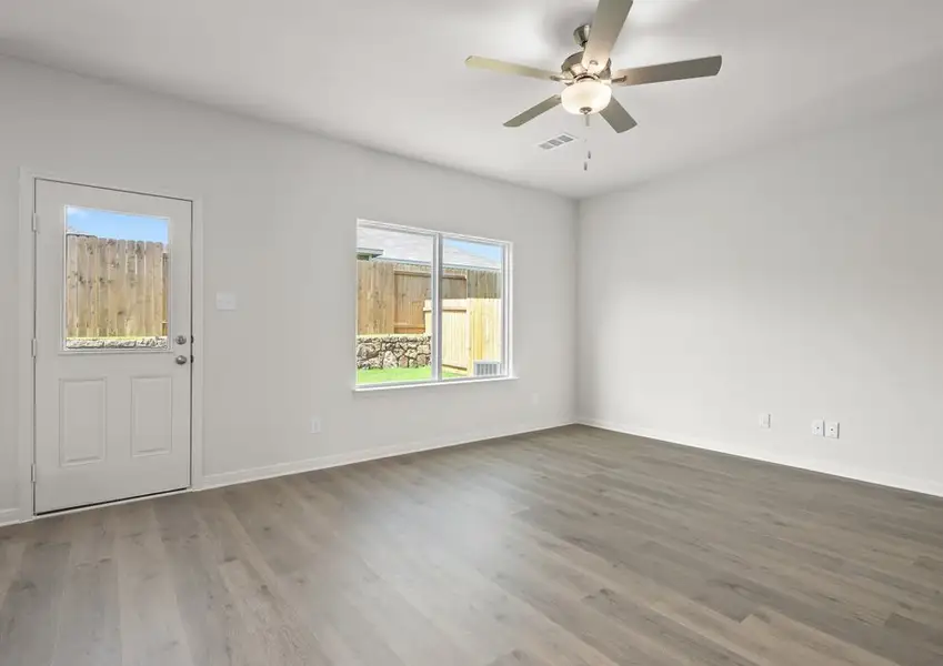 The spacious family room is perfect for family living and hosting. The spacious family room is perfect for family living and hosting.