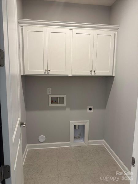 Laundry room with cabinets