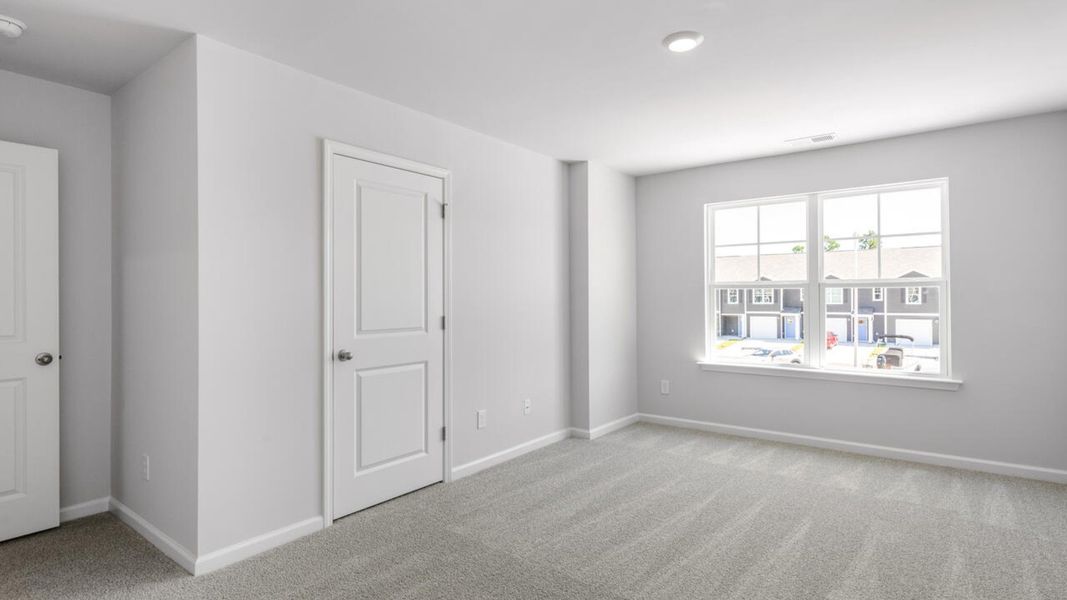 Spacious, unfurnished interior of a new home in The Landing at Sidbury Station, Castle Hayne (Image 26).