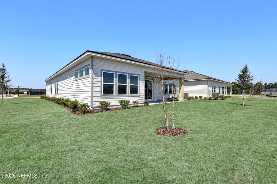 Exterior details and patio area of a home in New 55+ Active Adult Community in St. Augustine, St. Augustine (Image 14).