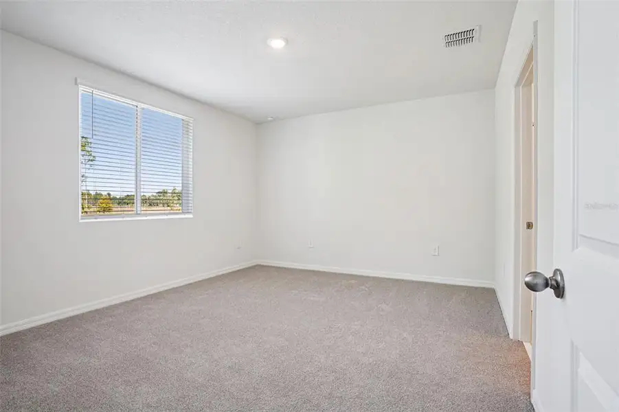 Spacious, unfurnished interior of a new home in Ridgehaven - Villas, Ormond Beach (Image 19).