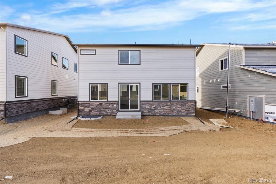Exterior details and patio area of a home in Harvest Crossing, Aurora (Image 4).