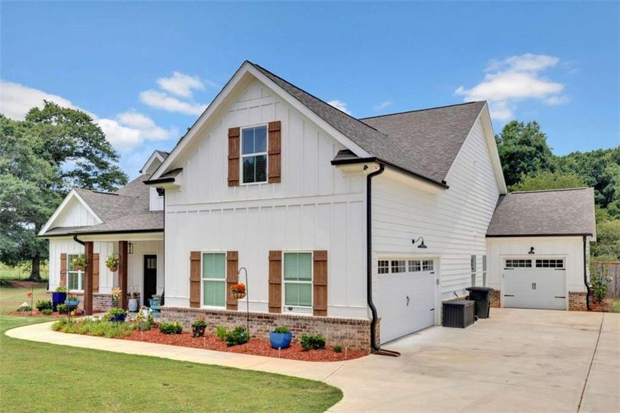 Front exterior of a new home in , Monroe, GA, highlighting curb appeal (Image 23).