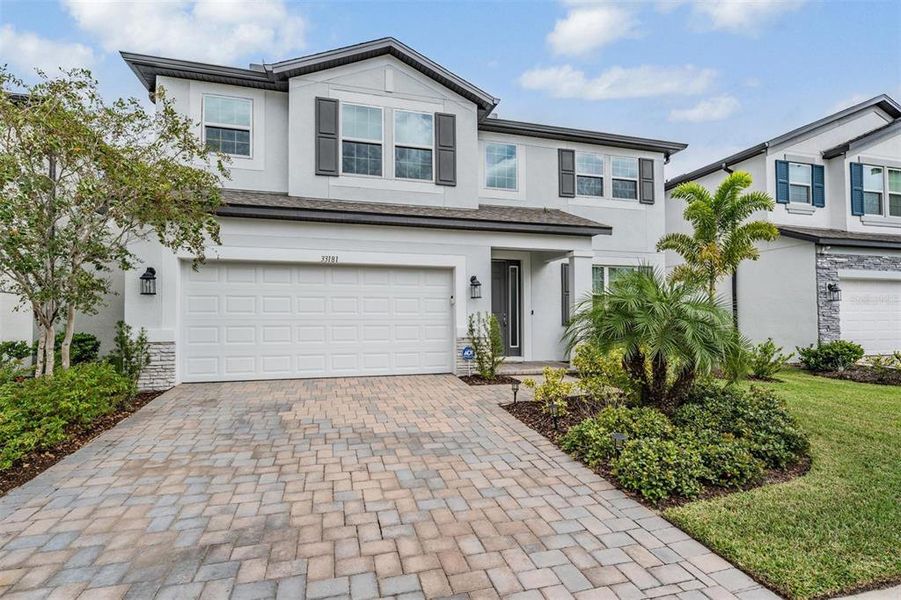 Front exterior of a new home in , Wesley Chapel, FL, highlighting curb appeal (Image 28).