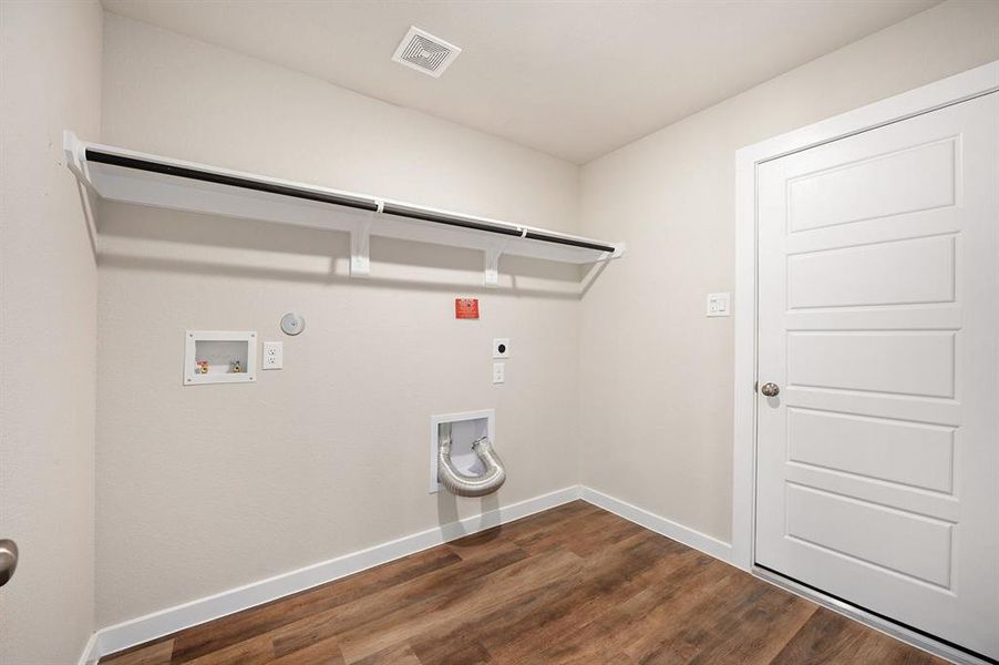 Utility room located inside the home and is very spacious. It also offers access to the 2 car garage.