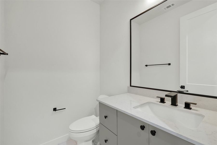 Bathroom with vanity and toilet