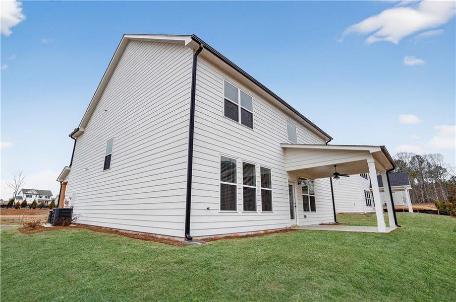 Exterior details and patio area of a home in The Fairways at Mirror Lake, Villa Rica (Image 19).