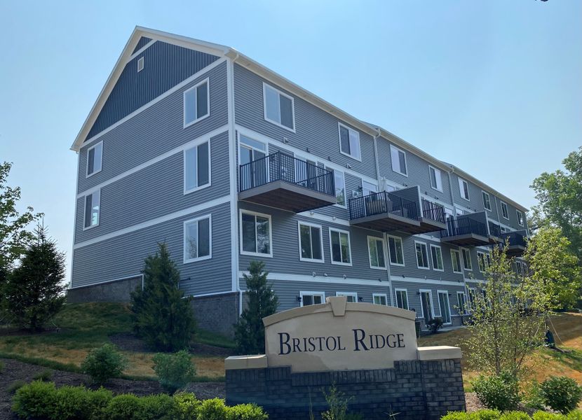 Representative exterior photo of a completed home built from the The Keswick  Townhome (End Viewout) by Norfolk Homes in Bristol Ridge Townhomes, Ann Arbor, MI (Image 22).