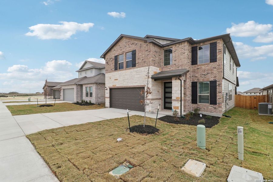 Front exterior of a new home in Legendary Trails - Premier Series, Cibolo, TX, highlighting curb appeal (Image 20).