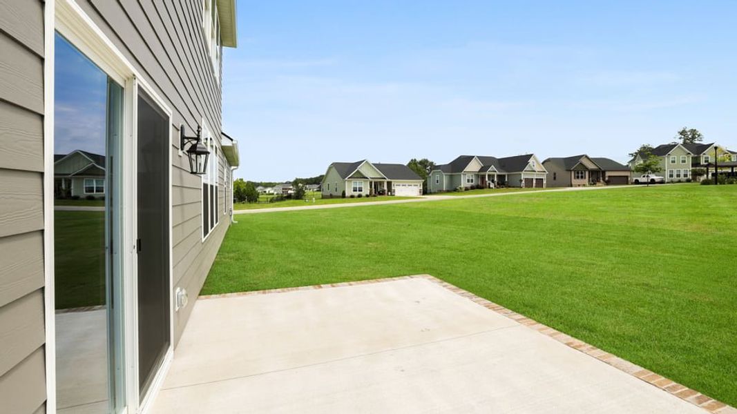 Exterior details and patio area of a home in Alder Pond, Campobello (Image 3).