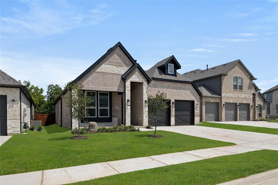 Front exterior of a new home in Birdsong, Mansfield, TX, highlighting curb appeal (Image 24). Front exterior of a new home in Birdsong, Mansfield, TX, highlighting curb appeal (Image 24).