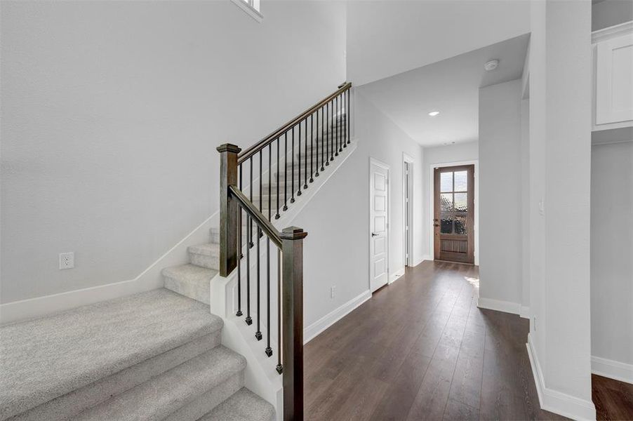 Stairway with baseboards and wood-type flooring Stairway with baseboards and wood-type flooring