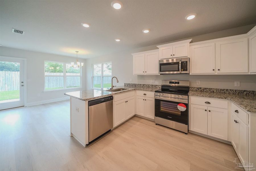 Furnished interior view inside a new home in Allison Acres, Cantonment (Image 4).