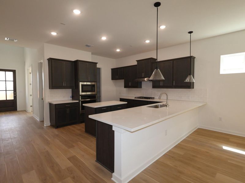 Furnished interior view inside a new home in Edgewood, Leander (Image 7). Furnished interior view inside a new home in Edgewood, Leander (Image 7).