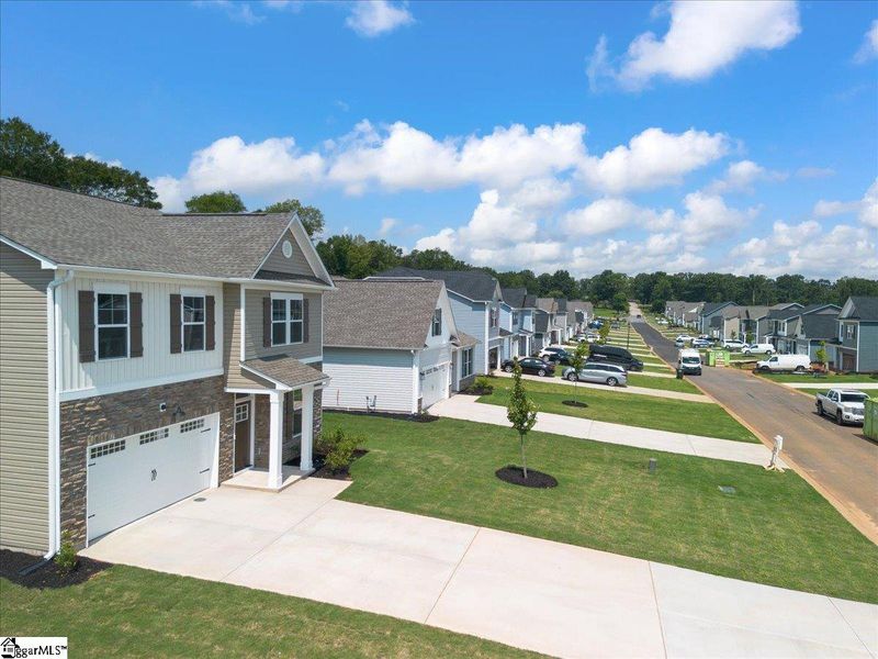 Front exterior of a new home in Lynbrook, Boiling Springs, SC, highlighting curb appeal (Image 23). Front exterior of a new home in Lynbrook, Boiling Springs, SC, highlighting curb appeal (Image 23).
