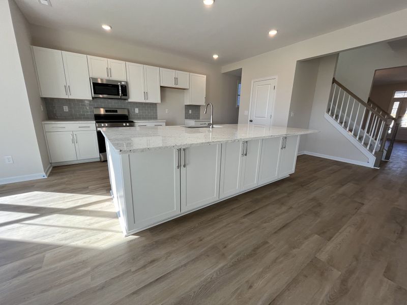 Furnished interior view inside a new home in River Tide Farms, Bolivia (Image 6).