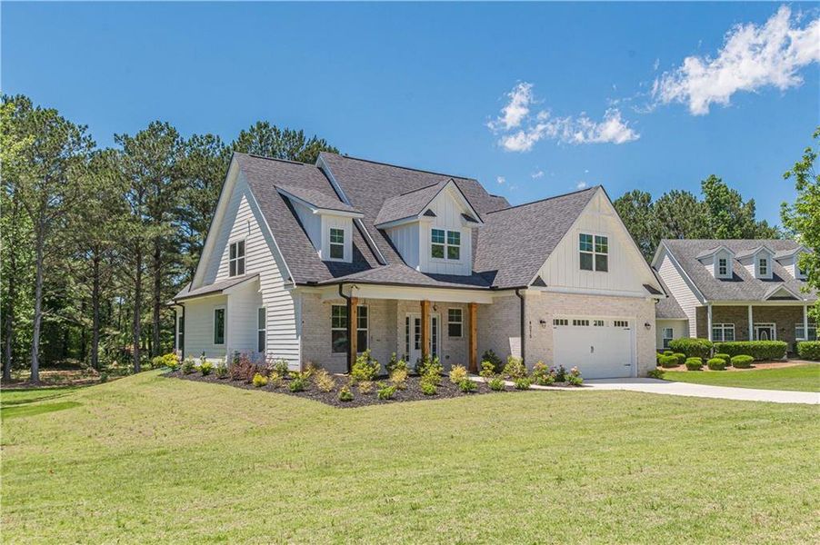 Front exterior of a new home in , McDonough, GA, highlighting curb appeal (Image 2).