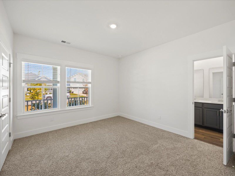 Spacious, unfurnished interior of a new home in The Coves at Lakes of Cane Bay II, Summerville (Image 13).