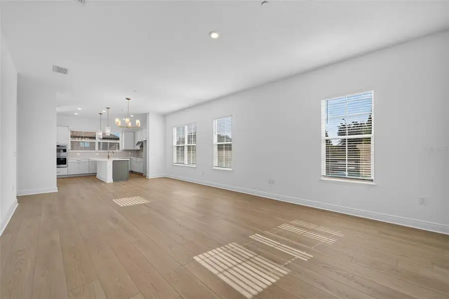 Spacious, unfurnished interior of a new home in Lake Cawood Cove, Windermere (Image 11).