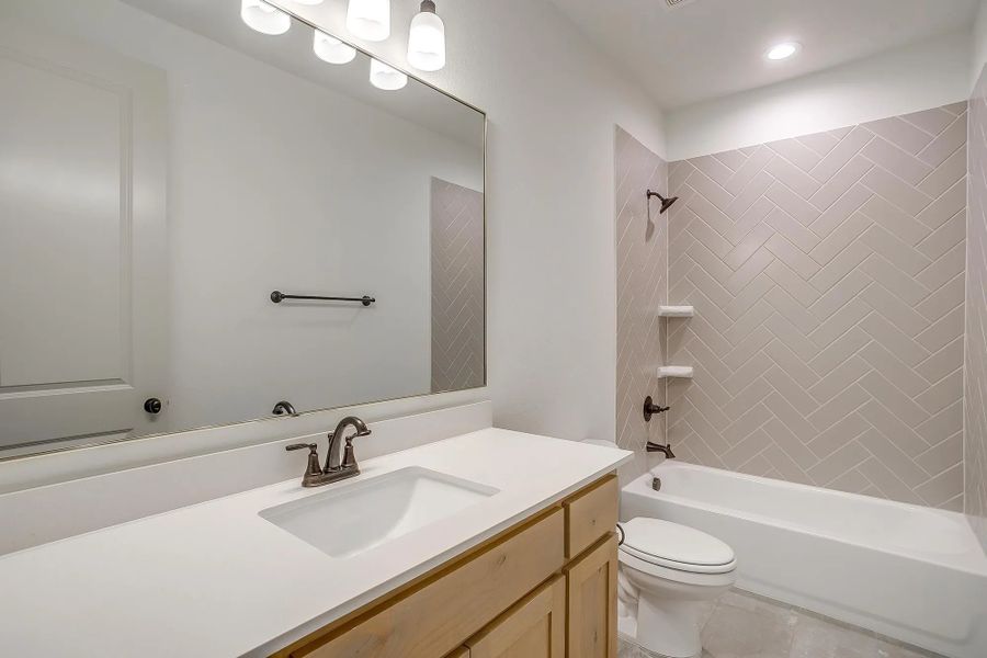 Representative furnished interior of a home built from the The Carley by Elmwood Custom Homes in Matthews Farm, Venus (Image 18).