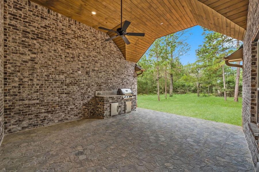 Covered patio with tongue and grove pine ceiling, pre-wired for TV & stone flooring