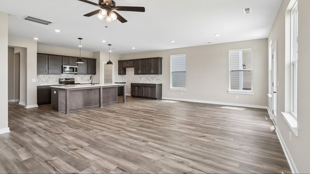 First Floor with hard surface flooring and kitchen