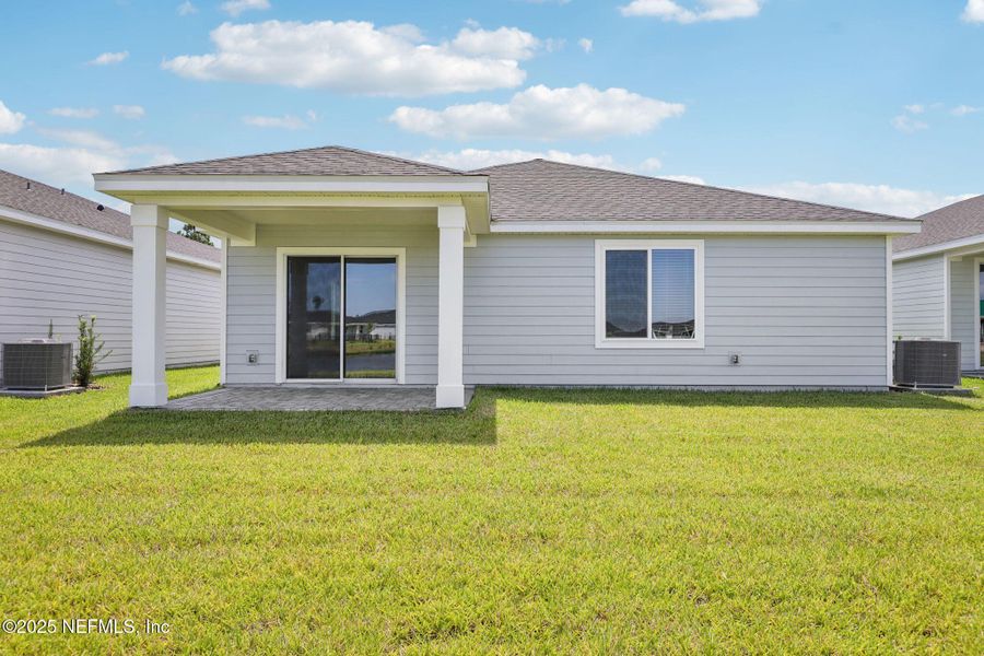 Exterior details and patio area of a home in Colbert Landings, Palm Coast (Image 22).