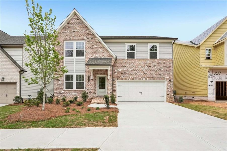 Front exterior of a new home in Arbors at Richland Creek, Buford, GA, highlighting curb appeal (Image 2). Front exterior of a new home in Arbors at Richland Creek, Buford, GA, highlighting curb appeal (Image 2).