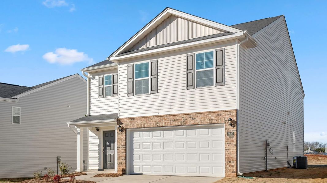 Front exterior of a new home in Willow Mill, Thomasville, NC, highlighting curb appeal (Image 2). Front exterior of a new home in Willow Mill, Thomasville, NC, highlighting curb appeal (Image 2).