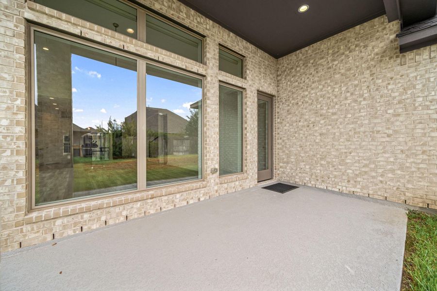 This back porch is large enough to have an outdoor table setup and add a bbq pit to enjoy gatherings together.