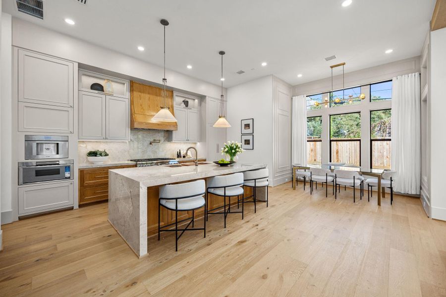 Chef's Kitchen offers a beautiful Taj Mahal quartzite on the counters of a large island &. backsplash. Fully equipped with high-end appliance package including: 48in Refrigerator, 48in gas range, miele built-in coffee make, drawer microwave Chef's Kitchen offers a beautiful Taj Mahal quartzite on the counters of a large island &. backsplash. Fully equipped with high-end appliance package including: 48in Refrigerator, 48in gas range, miele built-in coffee make, drawer microwave